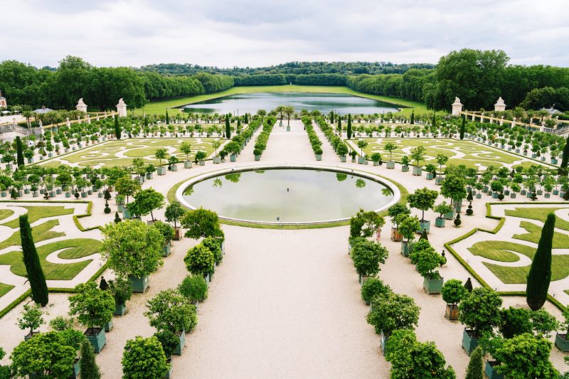 Beautiful formal garden with symmetrical design and water features at Pennywood Tours.
